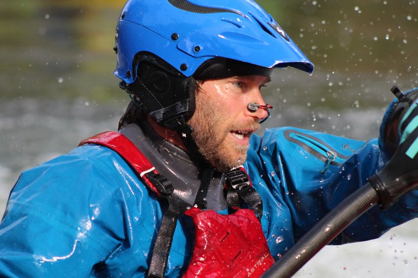 Water droplets fall off Timothy Kunin as he competes in the intermediate division of the June 22 Kayak Rodeo at Clear Creek Whitewater Park.